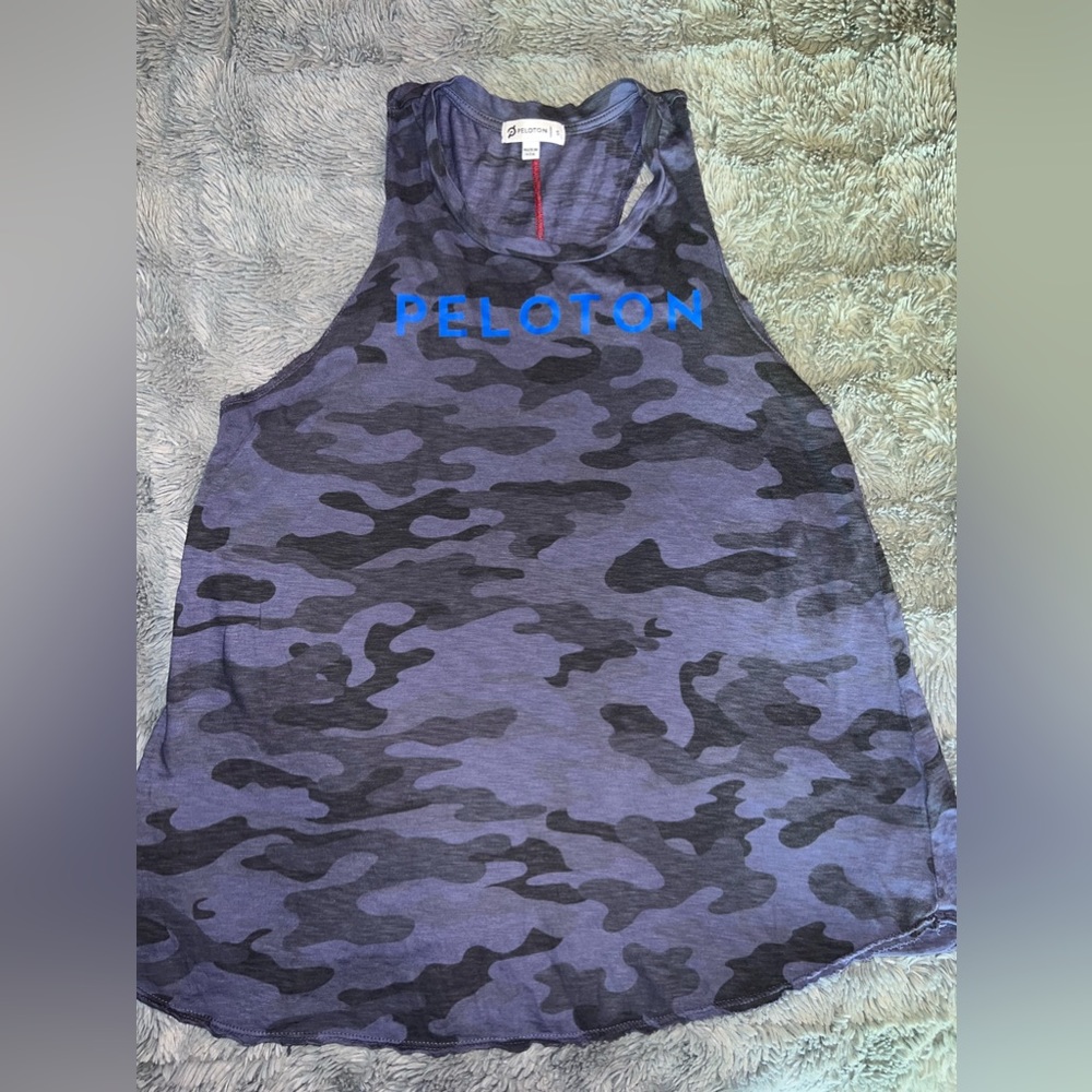Peloton size small blue camo with red seams.